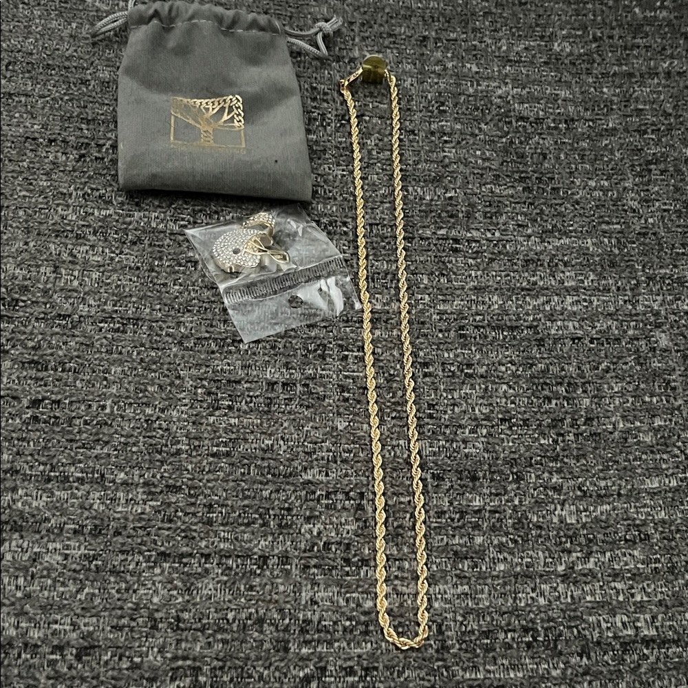 Gold Plated Necklace with gold plated crystal helmet.